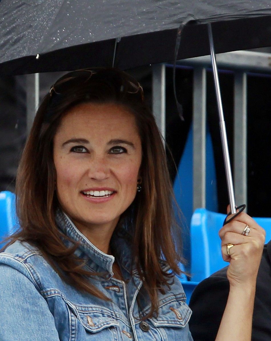 Pippa Middleton smiles before a rain break at the Queen039s Club Championships in west London
