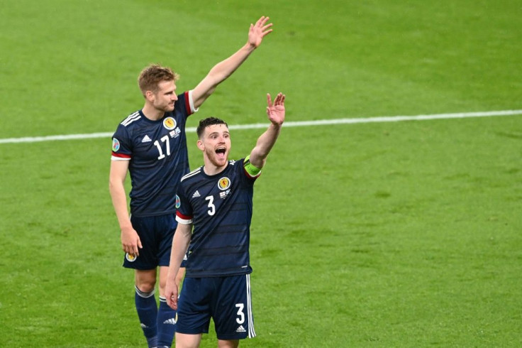High fives: Scotland earned a 0-0 draw away to England to keep their Euro 2020 hopes alive