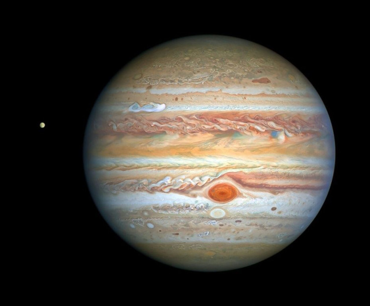 This photograph taken by the Hubble Space Telescope on August 25, 2020 shows Jupiter and its moon Europa, captured when the planet was 653 million kilometers (405 million miles) from Earth