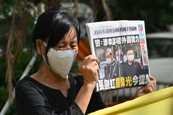 Dozens of supporters queued to get seats in court, including many former and current employees of Apple Daily