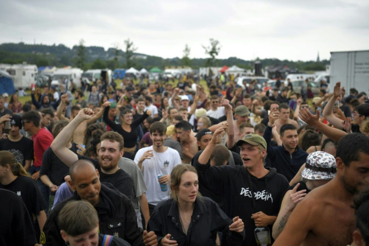 Participants take part in an illegal rave party in a field in Redon, north-western France.