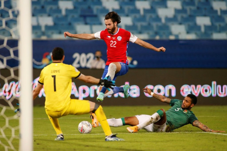 Brazil is hosting the Copa America soccer tournament -- in the photo Bolivia is playing against Chile -- even though the country is still firmly in the grips of the Covid-19 pandemic