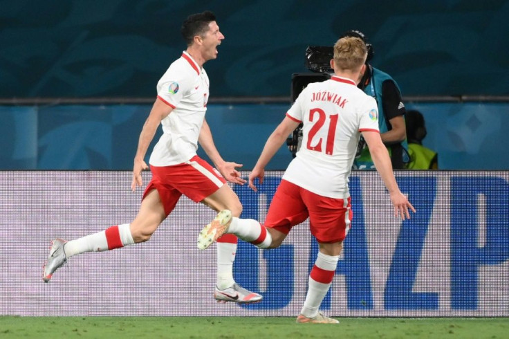 Robert Lewandowski's (L) header earned Poland a valuable point in Seville