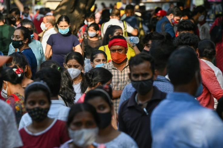 As a devastating coronavirus wave has eased, Indians have thronged markets and malls in many cities