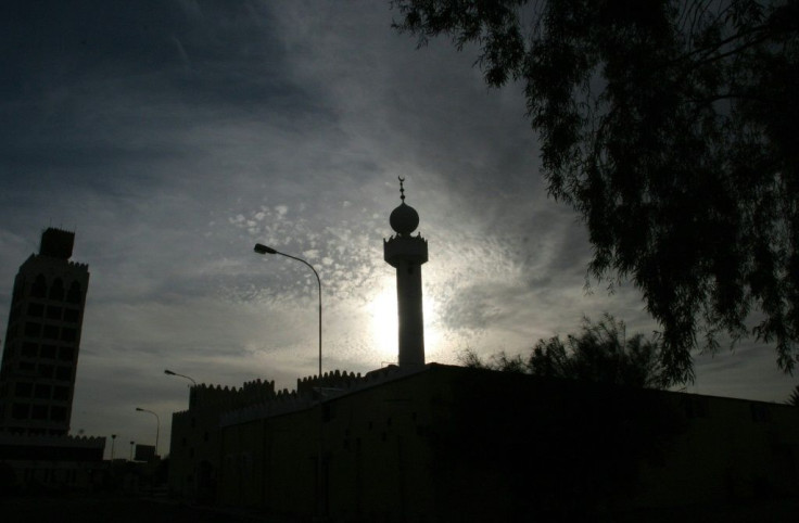 Sun sets behind a mosque in the Saudi city of Hael