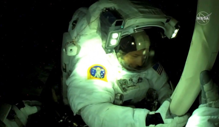 This NASA TV frame grab captured on June 20, 2021 shows US astronaut Shane Kimbrough seen from French astronaut Thomas Pesquet's helmet camera as the two installed a solar panel array on the International Space Station