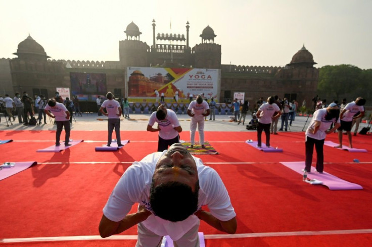 Indians marked International Yoga Day at the Red Fort in New Delhi as the country said it would open up free vaccinations to all adults