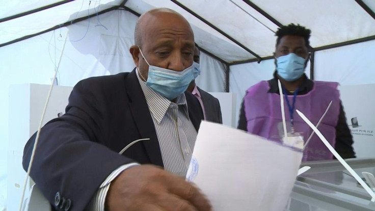 IMAGESBerhanu Nega, leader of Ethiopia's Ezema opposition party, votes in parliamentary and regional elections.