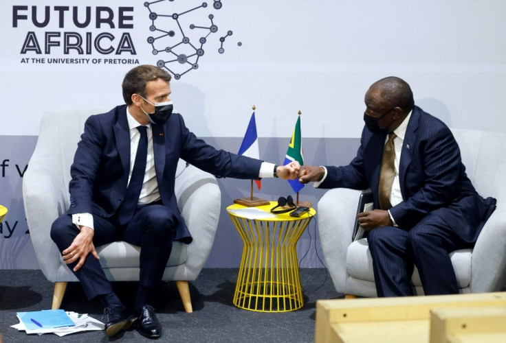 French President Emmanuel Macron, left, is backing the technology transfer initiative along with South Africa's Cyril Ramaphosa