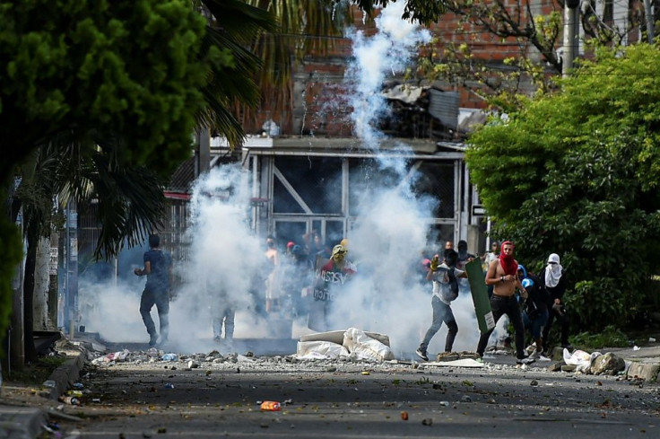 Demonstrators clashing with riot police in Cali, Colombia on June 4, 2021