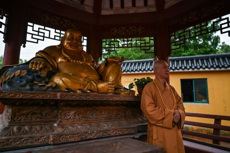 With help from volunteers and his small workforce, Zhi keeps several hundred dogs at his Bao'en Temple