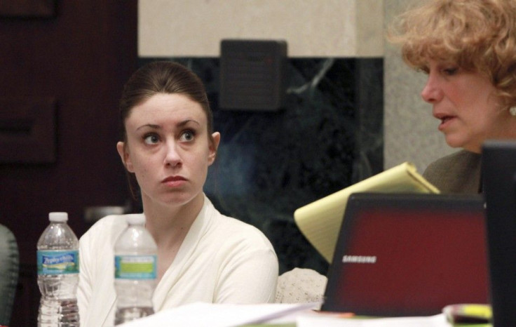 Casey Anthony (L) sits with her attorney