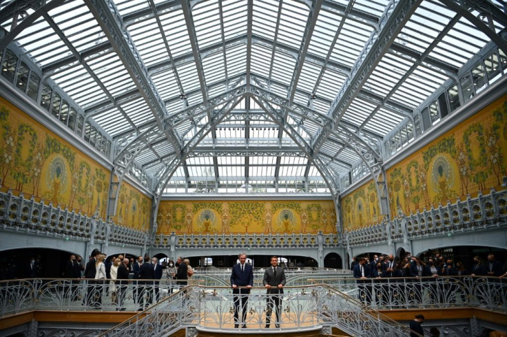 LVMH chief Bernard Arnault, left, and President Emmanuel Macron   inaugurated the restored Samaritaine department store in Paris on Monday.