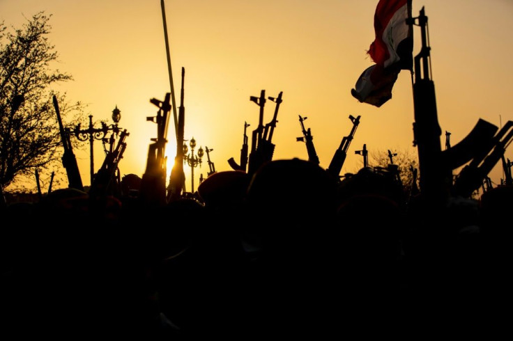 Fighters of Iraq's Hashed al-Shaabi paramilitary alliance hold an anniversary parade through the southern city of Basra. Since 2014, the alliance, which is largely made up of pro-Iran groups, has become the dominant force in Iraqi politics