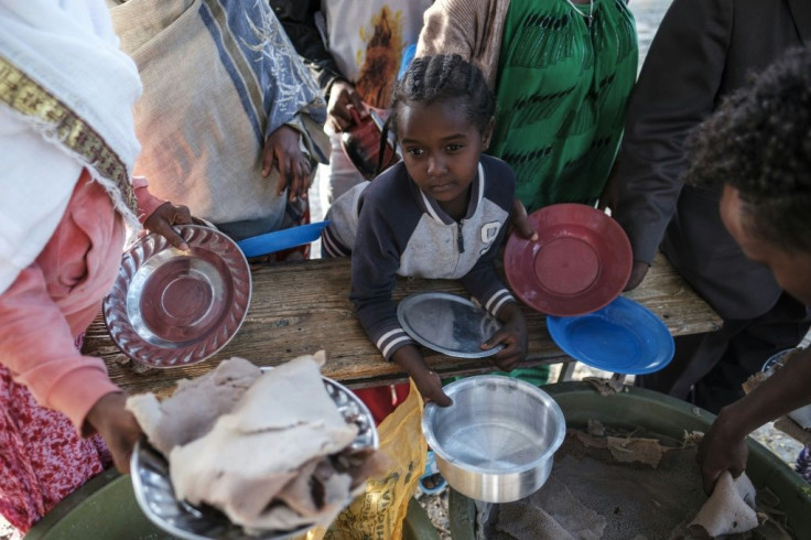 A displaced child from western Tigray waits in line for a plate of food in Mekele, the region's capital