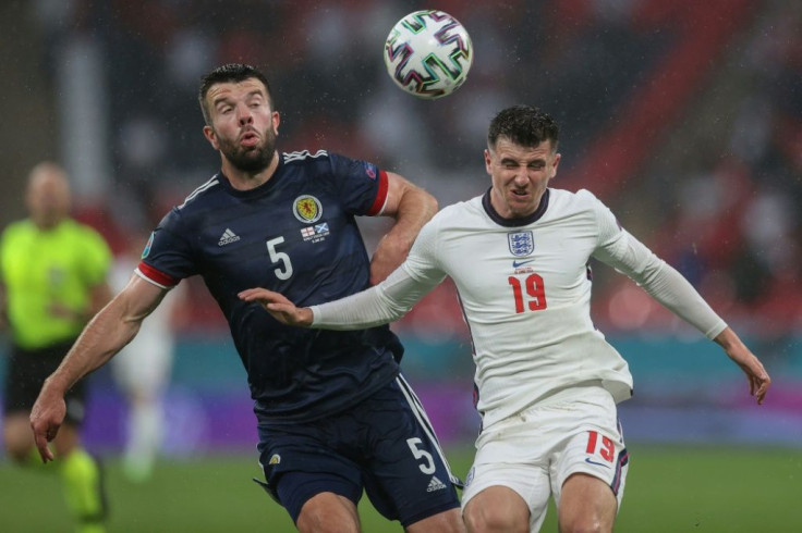 England midfielder Mason Mount (R) in action against Scotland