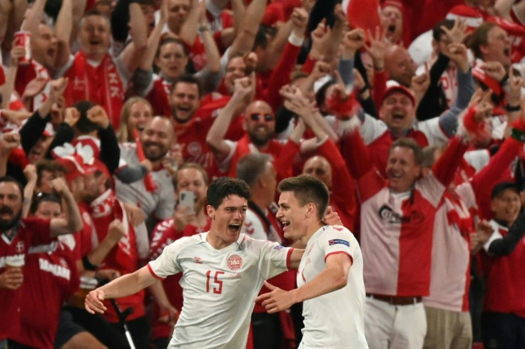 Denmark defender Joakim Maehle (R) celebrates after scoring against Russia