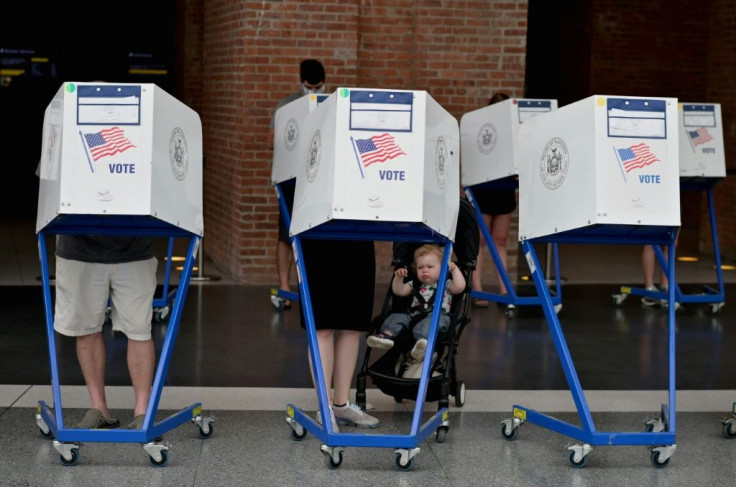 Residents vote during the New York City mayoral primary election at the Brooklyn Museum polling station on June 22, 2021 in New York City