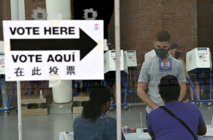 Residents vote during the New York City mayoral primary election at the Brooklyn Museum polling station on June 22, 2021 in New York City