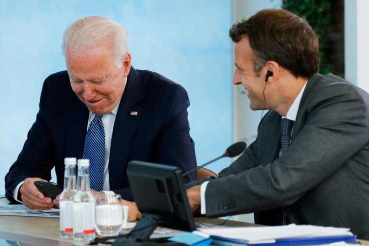 US President Joe Biden and French President Emmanuel Macron speak during a G7 summit in Carbis Bay, Cornwall, England on June 13, 2021 as the new US leader revives ties with allies