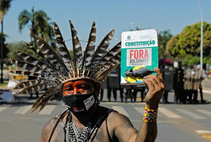 An indigenous man protests outside Brazil's Congress in Brasilia, on June 22, 2021