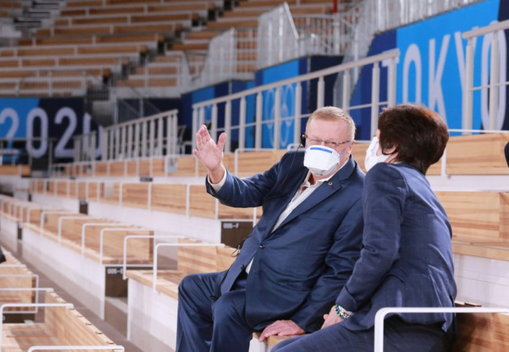 International Olympic Committee Vice President John Coates (L) talks with Tokyo 2020 President Seiko Hashimoto during their inspection of the Ariake Gymnastics Centre in Tokyo on June 23, 2021