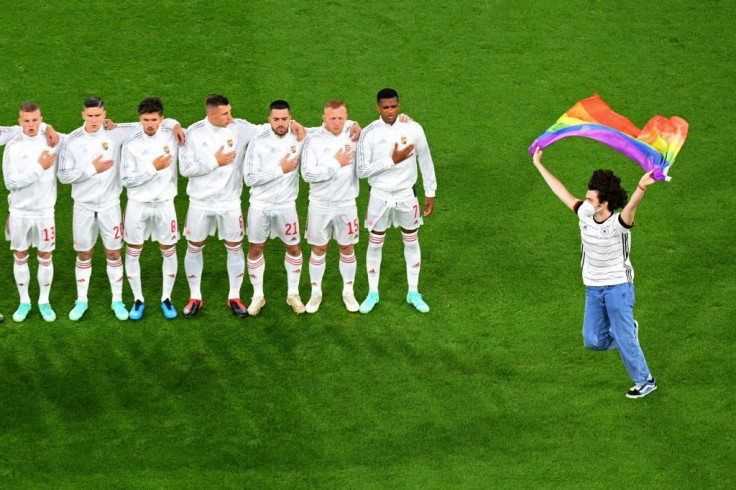 One fan invaded the pitch to brandish a rainbow flag