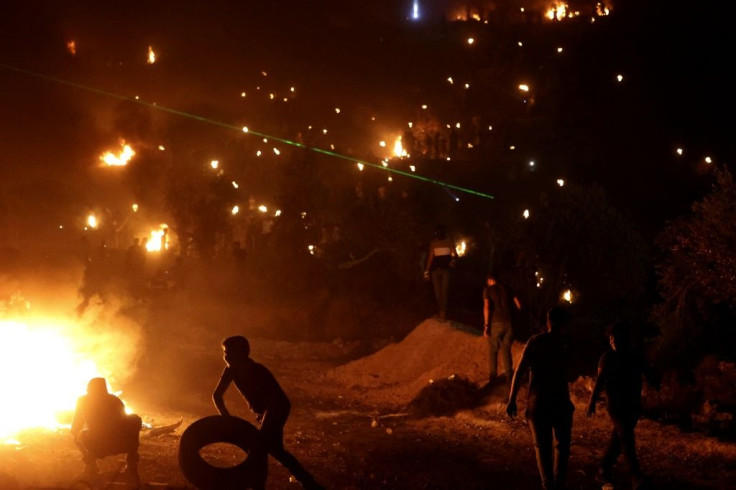 The protesting Palestinians burn tyres and the prevailing wind takes the acrid smoke towards the newly established Eviatar settlement