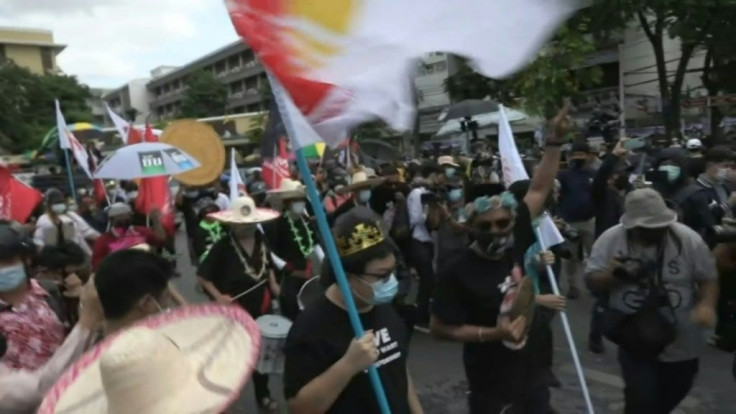 IMAGES Pro-democracy protesters call for the premier to resign as they march on the 89th anniversary of the Siamese Revolution -- an uprising that transformed Thailand from absolutism to a constitutional monarchy.  They took to the streets despite warning