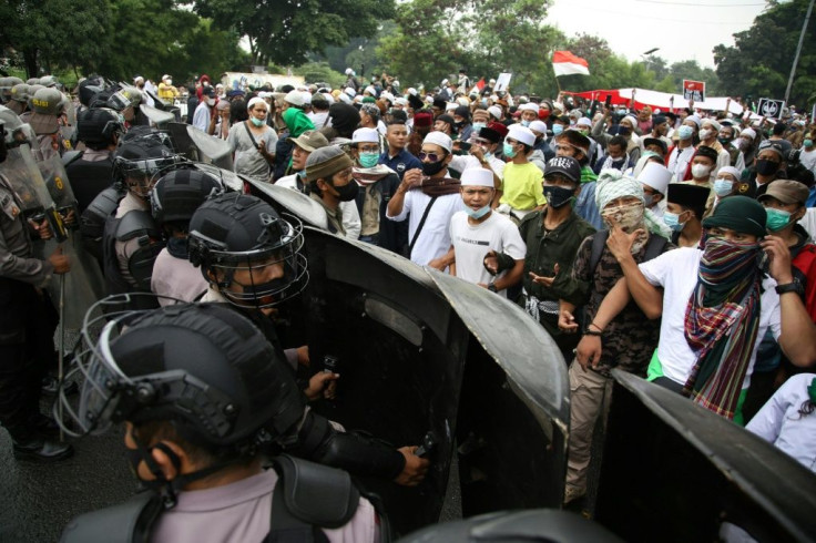 Supporters of Indonesian Muslim cleric Rizieq Shihab faced off with riot police in Jakarta