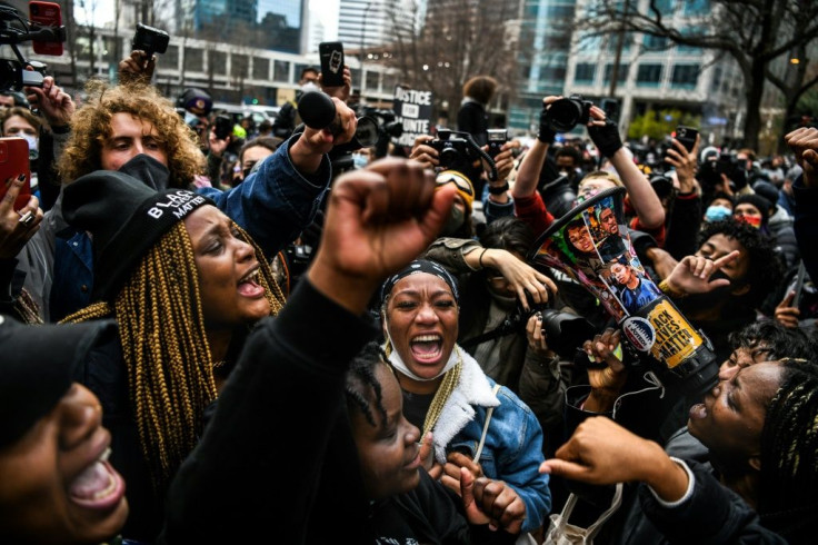 Demonstrators rejoice on April 20 2021 in Minneapolis as former police officer Derek Chauvin is found guilty of murdering African-American George Floyd