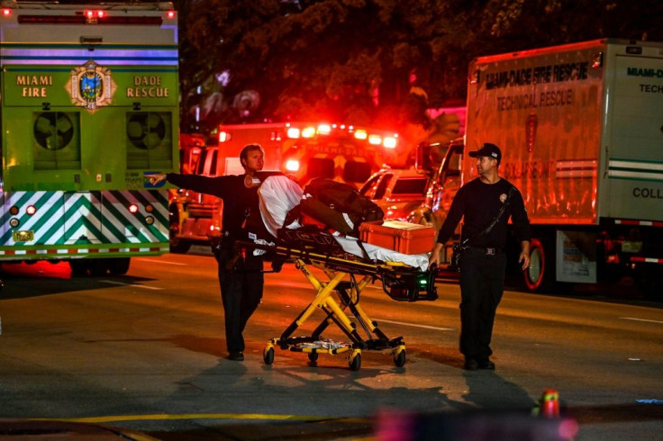 First responders arrive at the partially collapsed building overnight