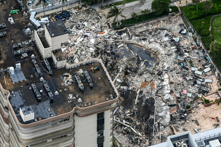 An aerial view shows the extent of the destruction after an apartment building pancaked in Miami on June 24 2021