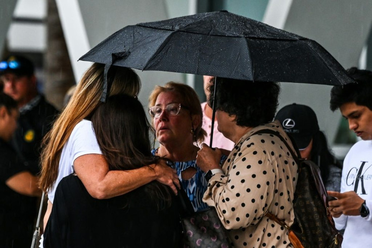 People gather together after the collapse of an apartmet building in Miami on June 24 2021