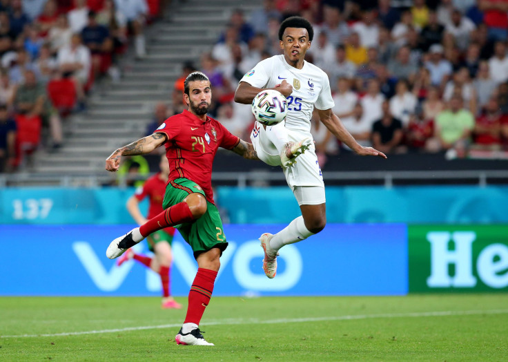 Sergio Oliveira of Portugal battles for possession with Jules Kounde of France
