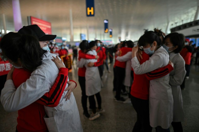 Medical staff hug nurses in Wuhan in April 2020 before they leave the city after working on the Covid-19 outbreak. The image was captured by Hector Retamal, who won first prize in the Excellence in Photography category at the 2021 SOPA awards