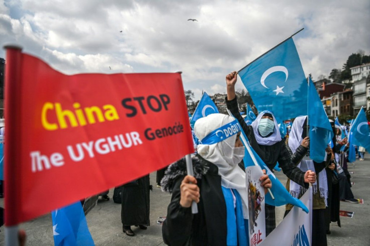 Ethnic Uyghur women  demonstrate near the Chinese consulate in Istanbul over the treatment of Uyghurs in China's Xinjiang region