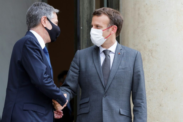 French President Emmanuel Macron greets US Secretary of State Antony Blinken at the Elysee Palace