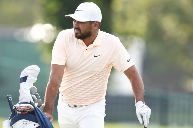 Australia's Jason Day battled back pain but fired an eight-under par 62 to seize a one stroke lead after Friday's second round of the US PGA Travelers Championship