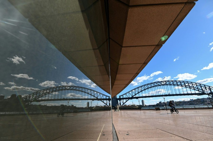 Sydney's normally bustling harbourside centre was nearly deserted after its lockdown took effect, a shock for a city that had returned to relative normality after months with very few Covid cases