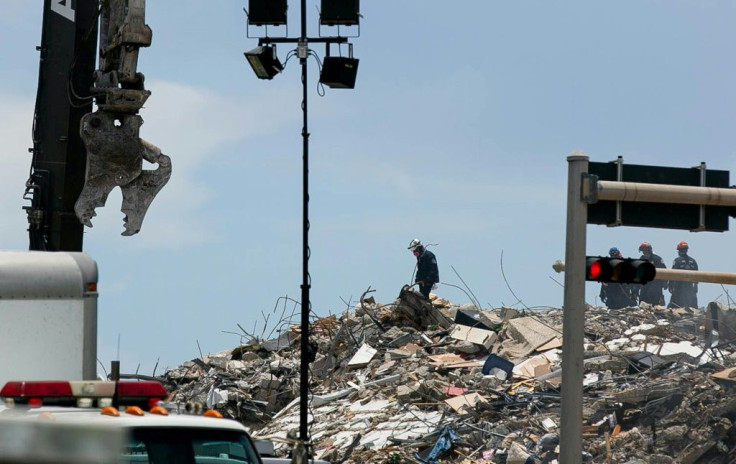 Rescue personnel continue to search the rubble at the site of a collapsed building in Surfside, Florida, north of Miami Beach, on June 26, 2021