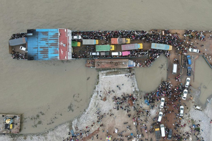 Tens of thousands of migrant workers boarded ferries to leave Dhaka, where a lockdown will cut off their revenue sources