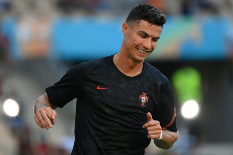 Cristiano Ronaldo was all smiles as he warmed up ahead of Portugal's mouthwatering tie against Belgium in Seville