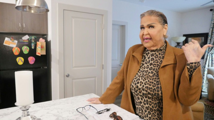Dina Jacobs speaks in the kitchen of her new apartment during the opening of the Law Harrington Senior Living Center, the largest LGBTQ senior residence in the United States, in Houston, Texas