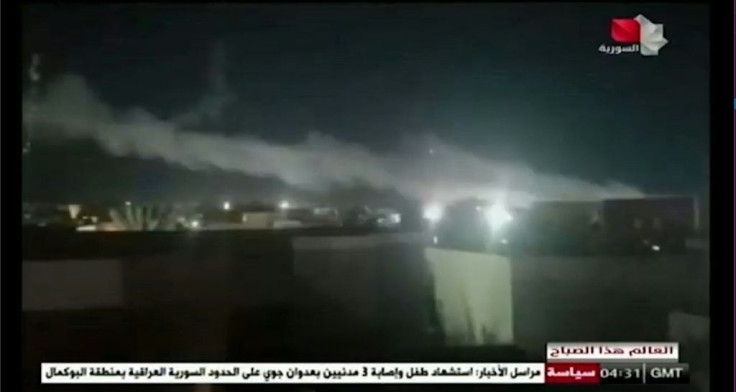 An image grab from Syrian state television shows smoke billowing over a facility used by Iran-backed groups following US air strikes on the Syrian-Iraqi border