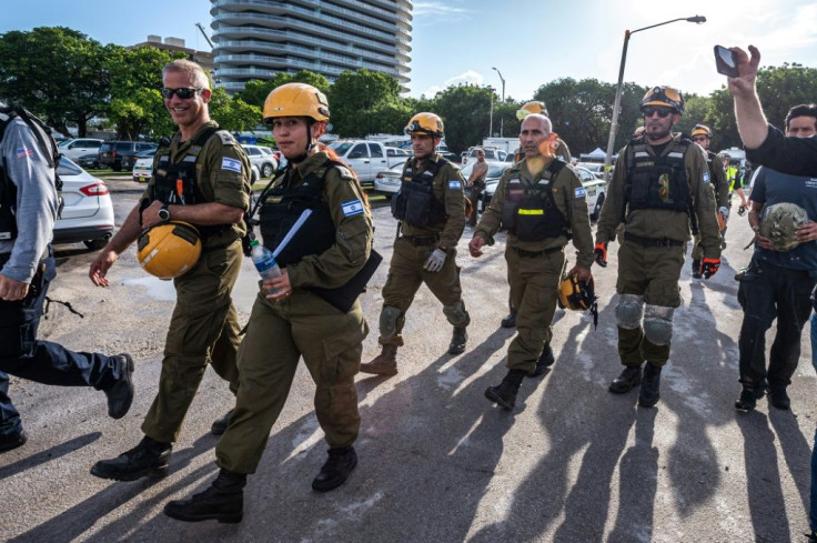 An Israeli rescue team arrive near the collapse building in Surfside on June 27, 2021
