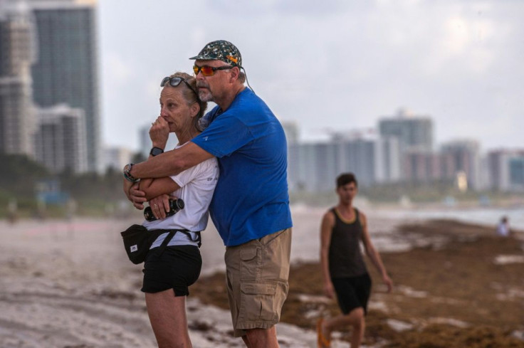 Neighbors pay tribute to lives lost on the beach near Champlain Towers South
