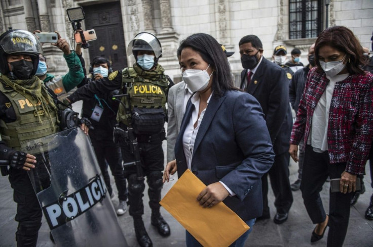 Peruvian presidential candidate Keiko Fujimori (C) wants an international audit of the election that she appears to have lost, according to unofficial results