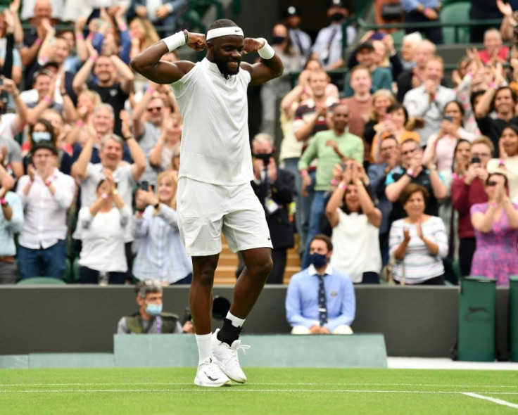 Stunner: Frances Tiafoe celebrates his win over Greece's Stefanos Tsitsipas