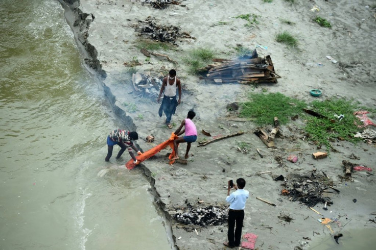 Families in India's north and east gave up the bodies of their loved ones to the Ganges river, or buried them in shallow graves on its banks, unable to afford the cost of funeral pyres during the height of the coronavirus outbreak